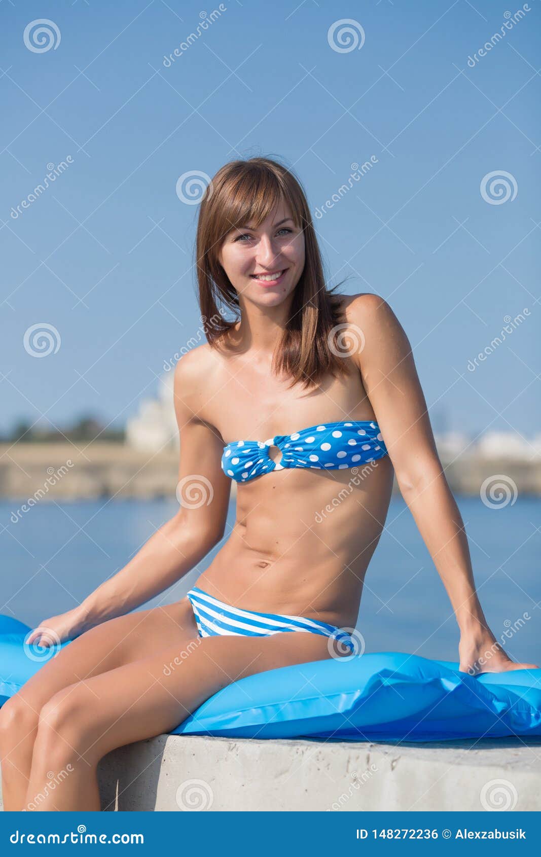 slim-tall-girl-blue-bikini-sea-athletic-girl-blue-bikini-sea-slim-tall-girl-swimwear-sitting-blue-148272236.jpg